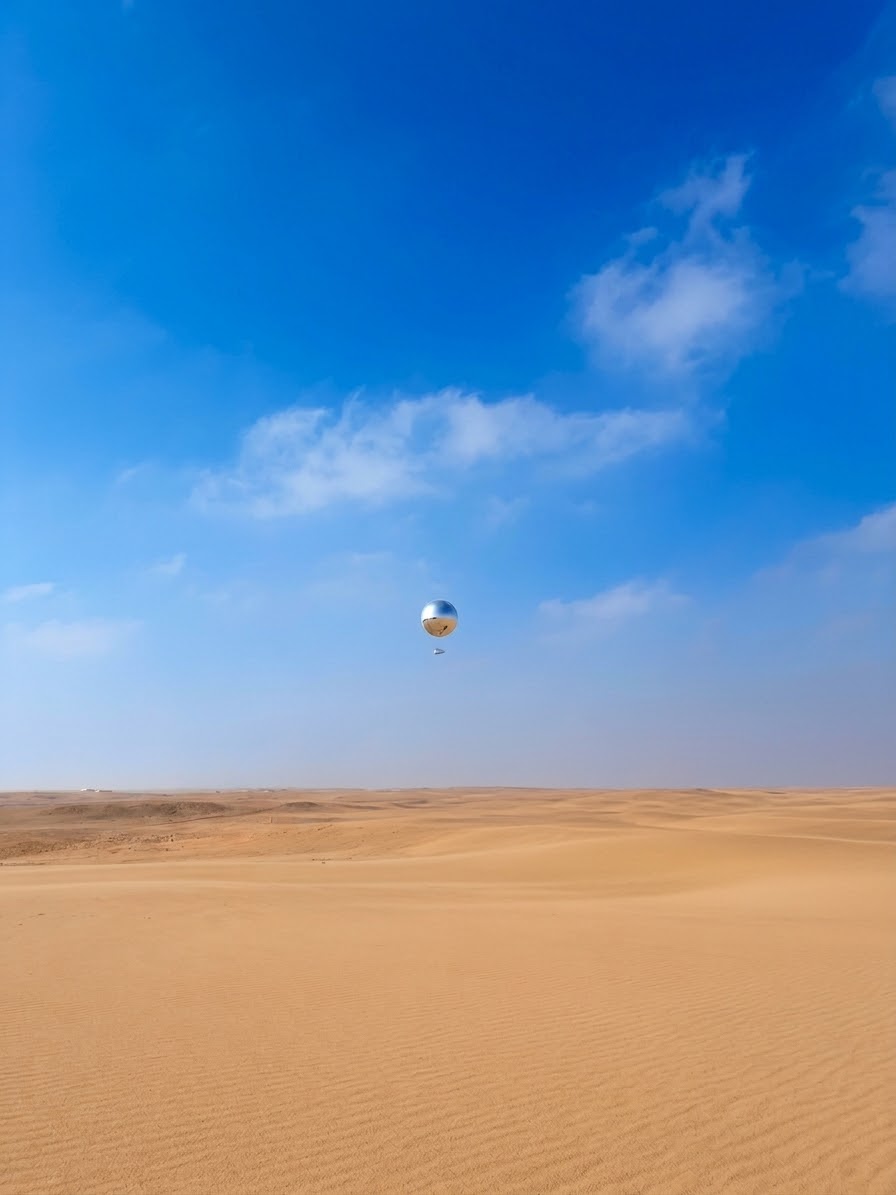 Tethered balloon high above Giza desert landscape near the Pyramids plateau